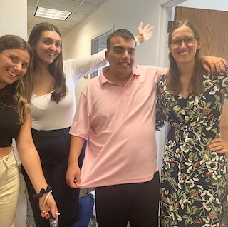 Dr. Clements, BRAIN Lab Lab Manager, and Research Assistant pose with the Research Assistant's brother. 